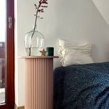 round and fluted bedside table in dusty pink