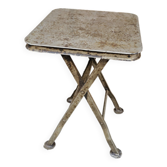 Old industrial folding steel stool