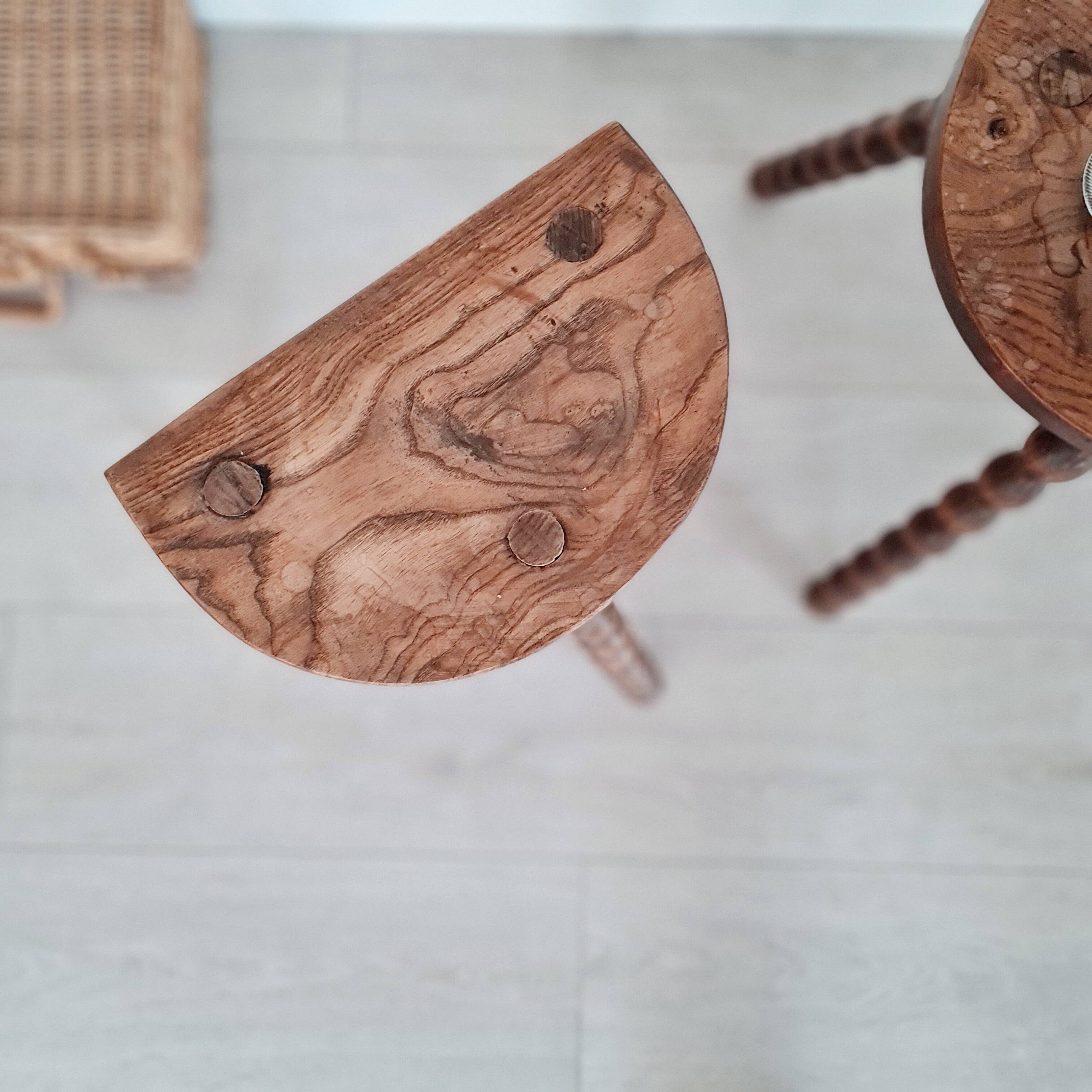 Pair of old wooden tripod stools