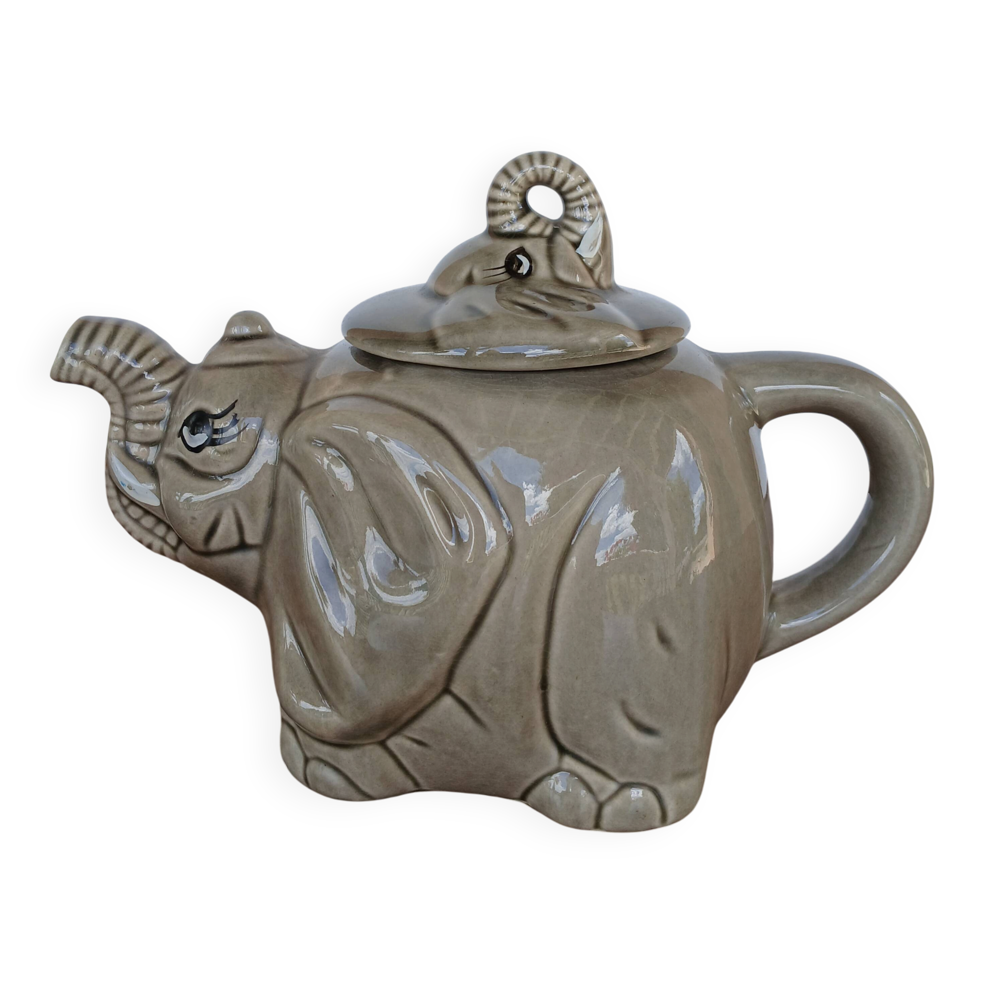 vintage ceramic teapot in the shape of a grey elephant