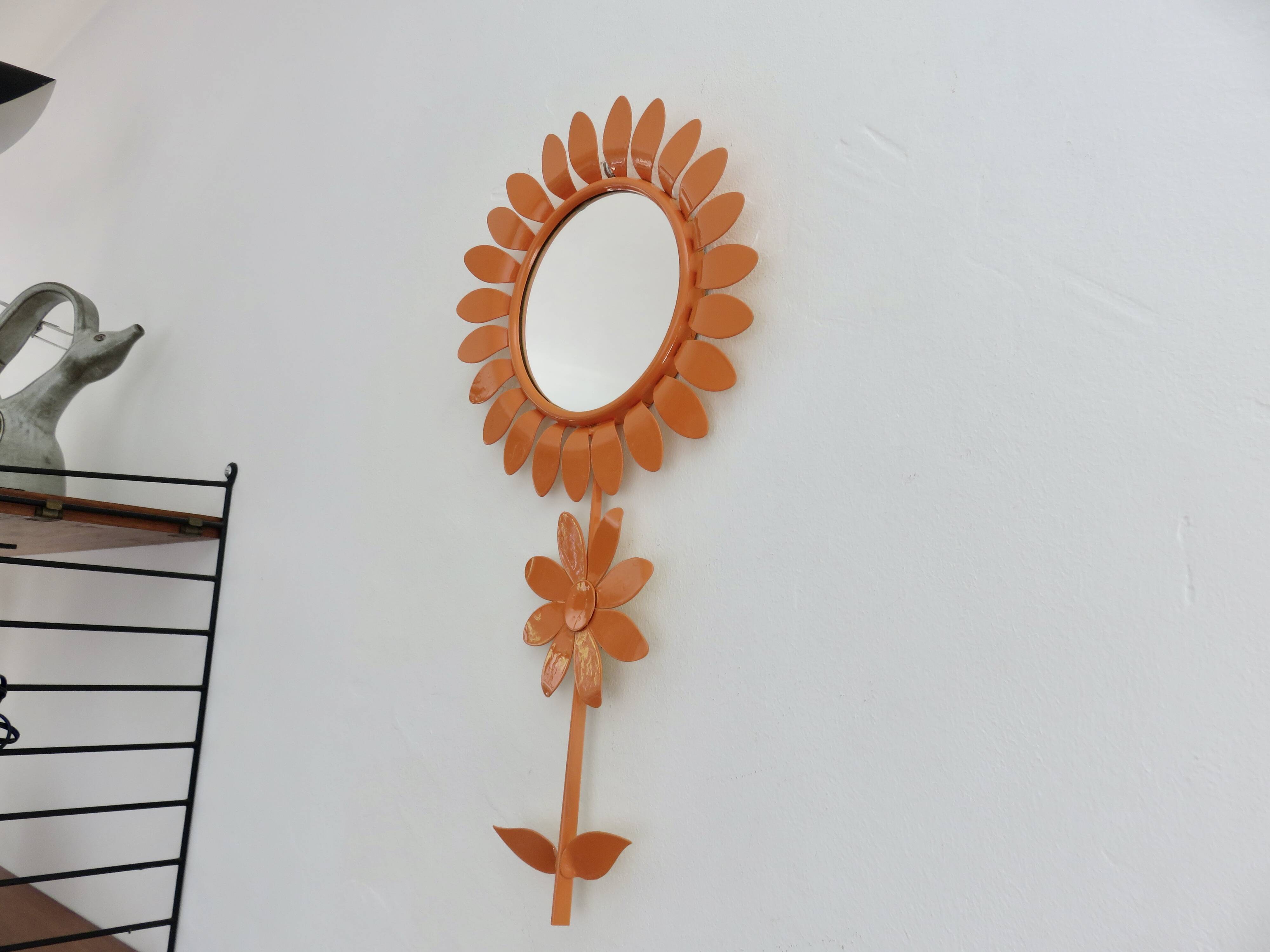 Large 1970s "flower" mirror in orange metal