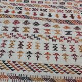 White carpet with multicolored Berber patterns