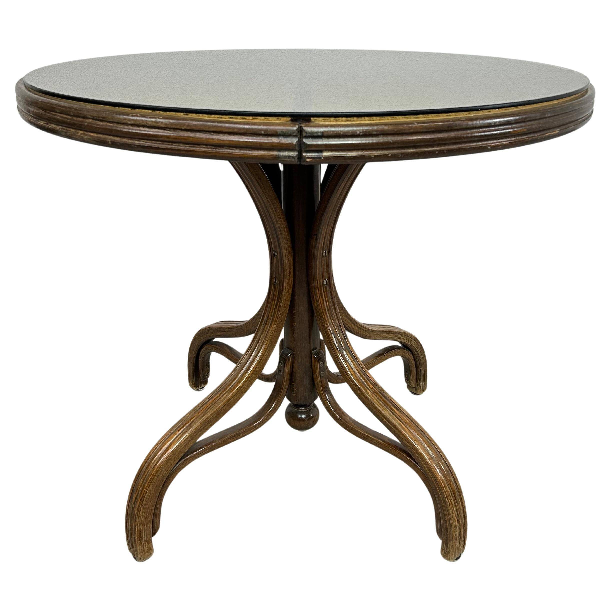 Thonet dining table for 4 people with a glass top.