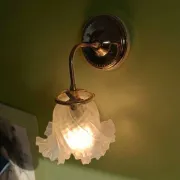 Chic retro wall light in gold brass & pink glass tulip
