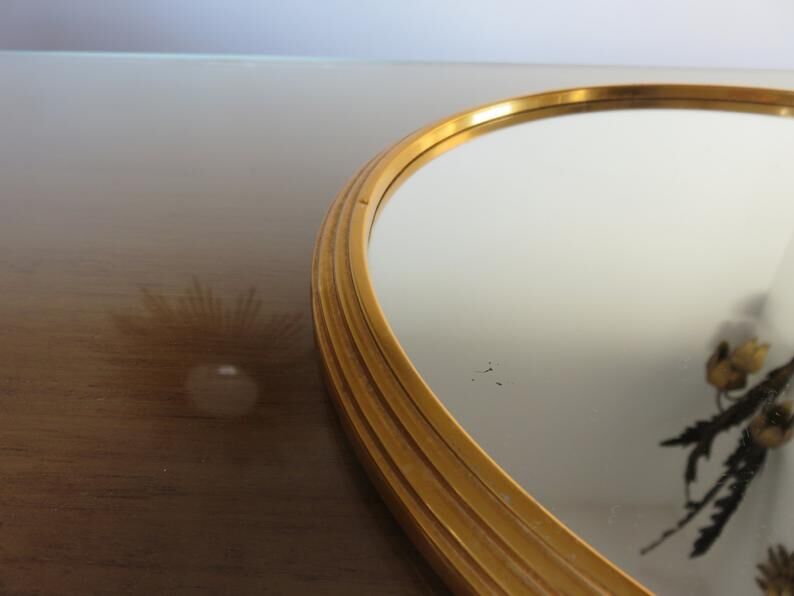 Round mirror tray in 1950s gold metal
