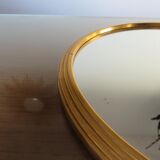 Round mirror tray in 1950s gold metal