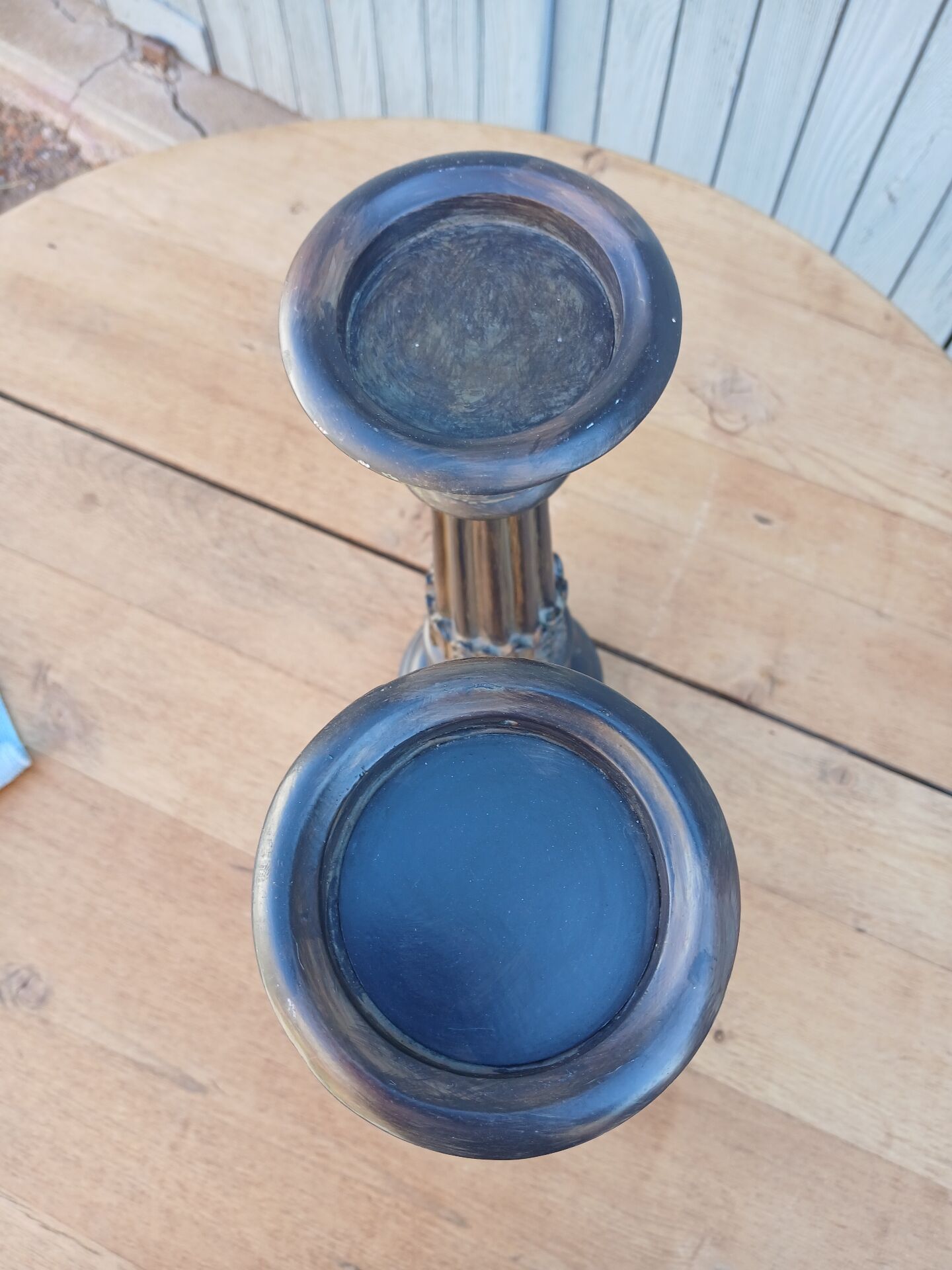 2 carved wooden candlesticks