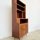Mahogany library — closed storage and open cubbies, custom-made, 1960s.