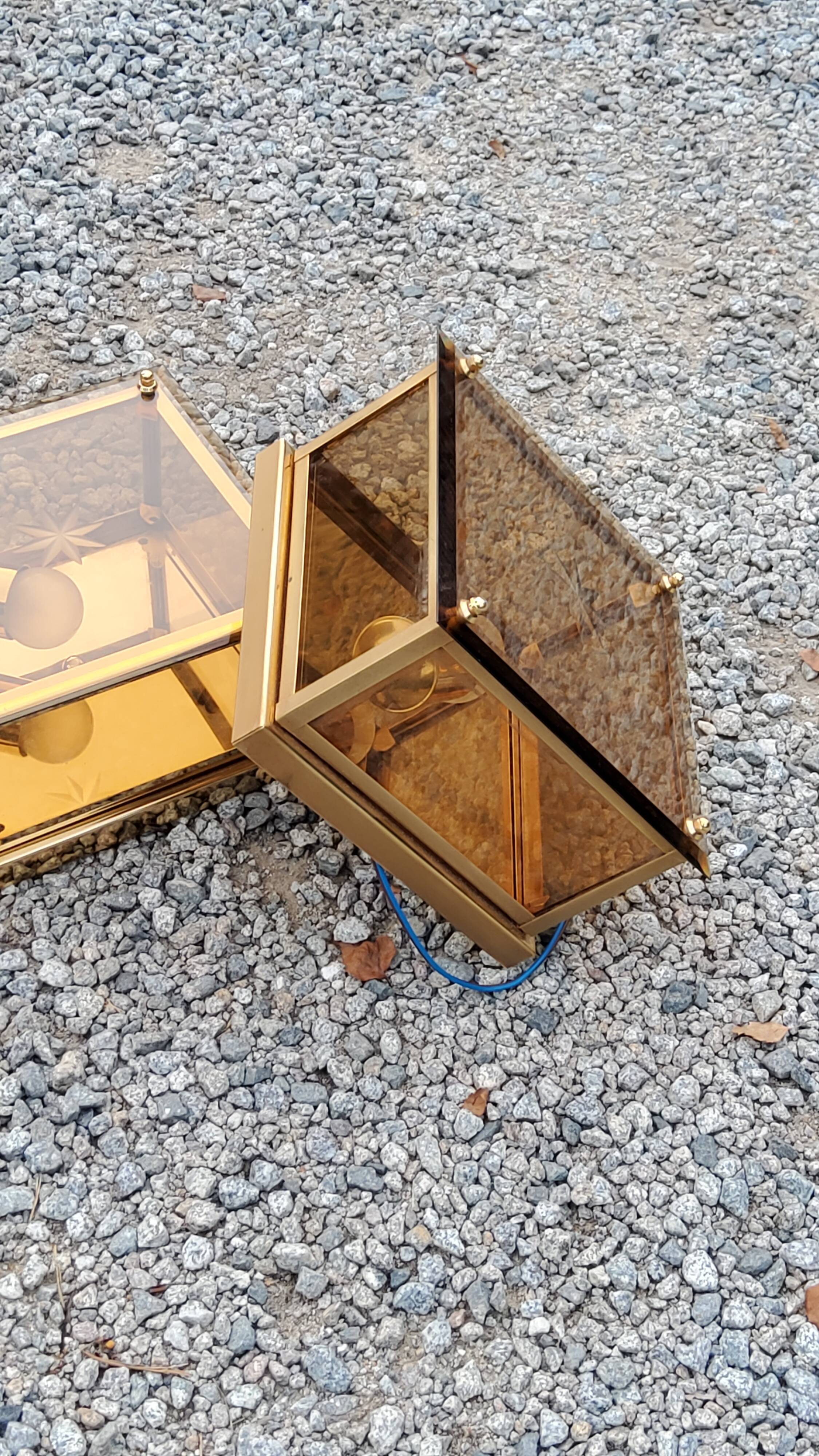 Pair of wall lamps in smoked glass and gilded metal from the 70s/80s