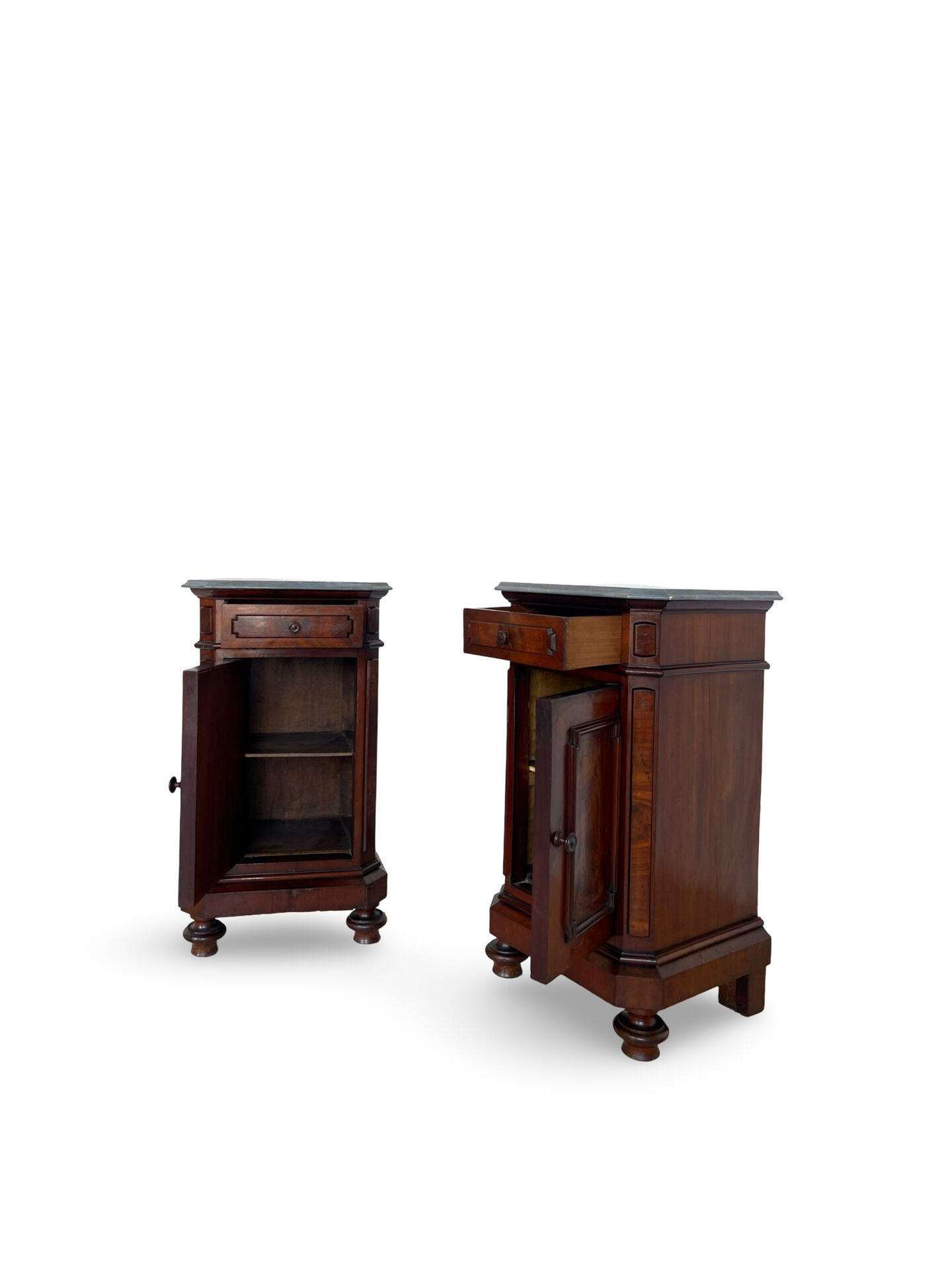 A pair of antique walnut bedside tables from the 1890s.