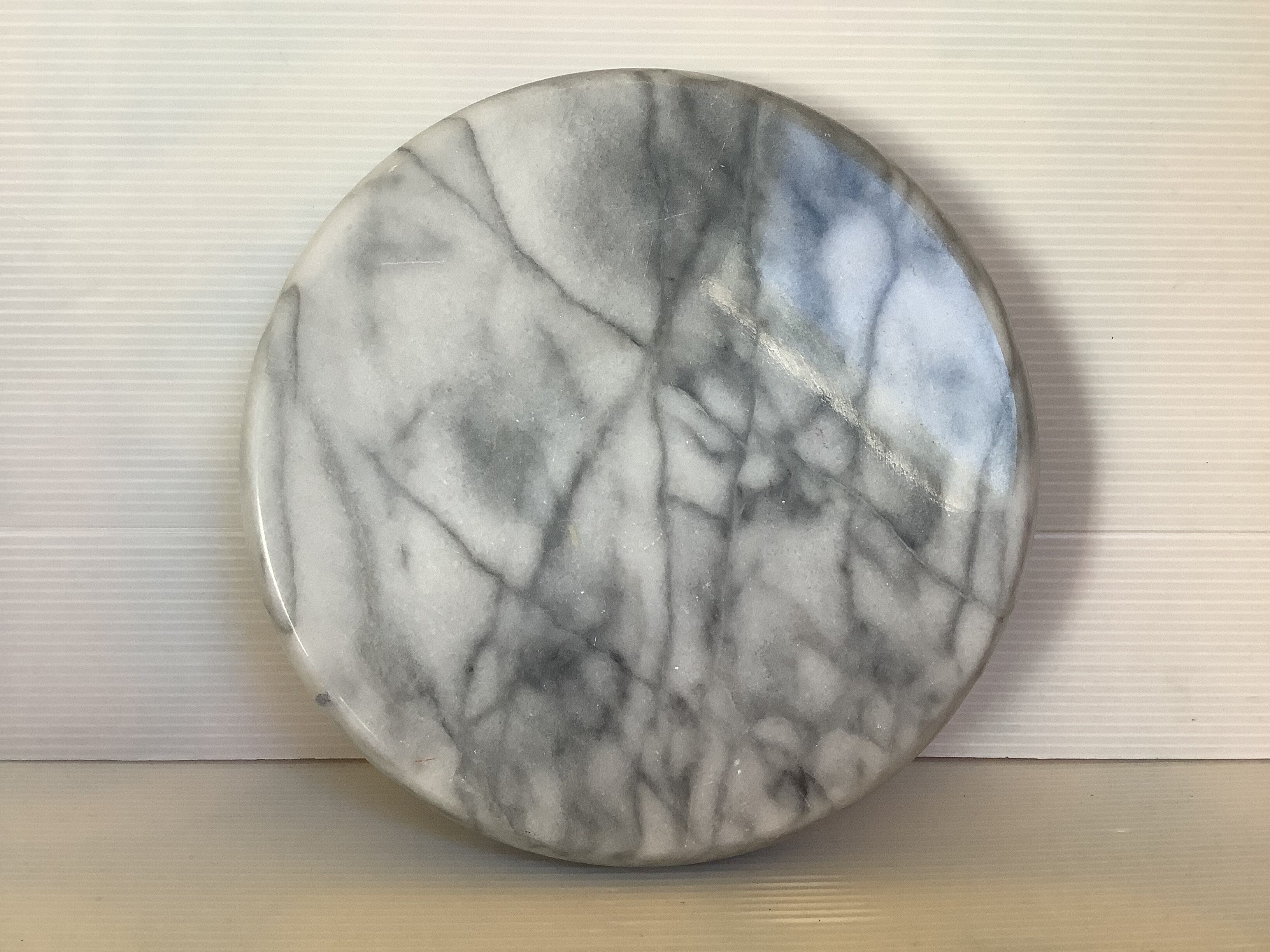 Empty round pocket in gray marble