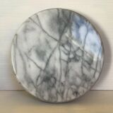 Empty round pocket in gray marble