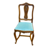 Vintage Louis XV chair made of carved solid wood with blue velvet fabric.