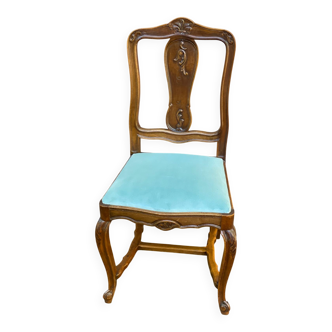 Vintage Louis XV chair made of carved solid wood with blue velvet fabric.