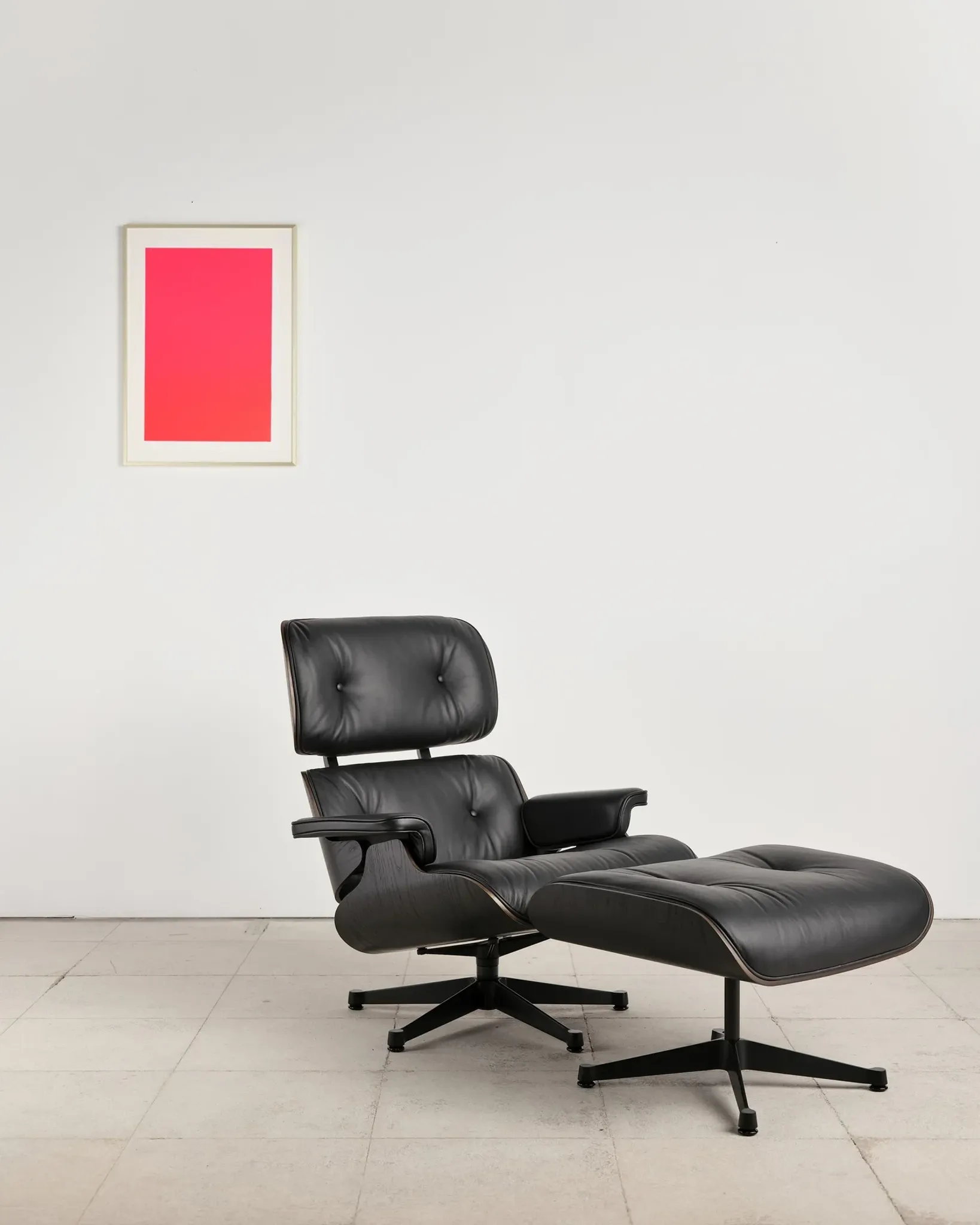 Lounge Chair and ottoman in black leather by Charles & Ray Eames, Vitra
