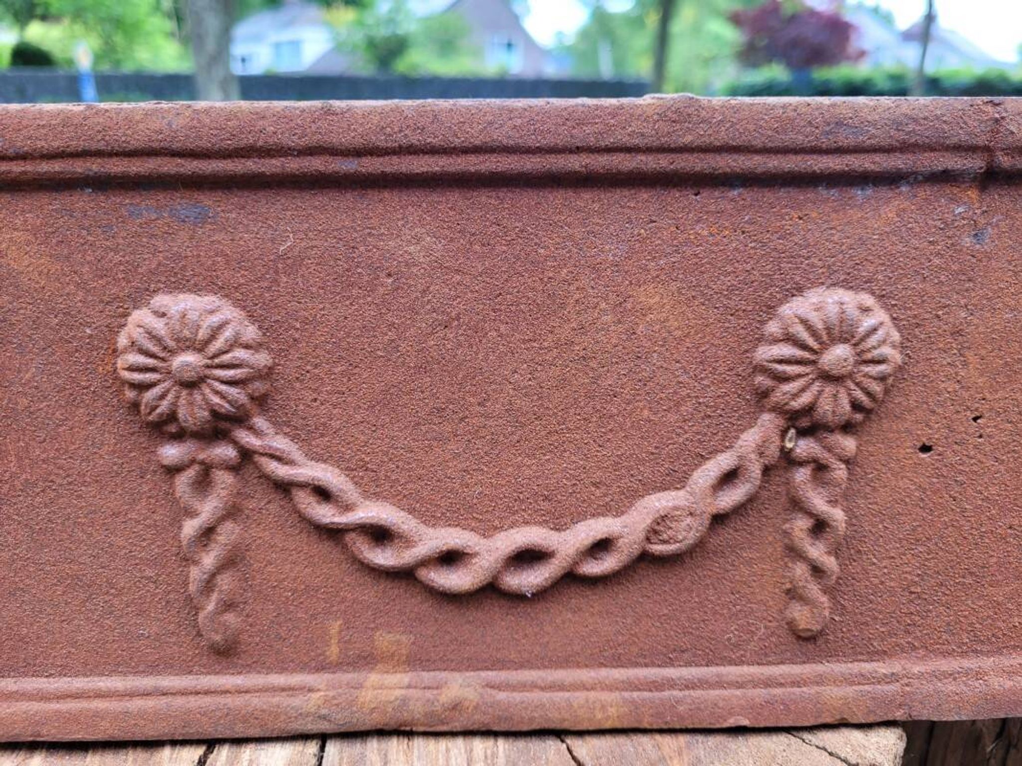 Rusty cast iron jardiniere planter