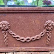 Rusty cast iron jardiniere planter