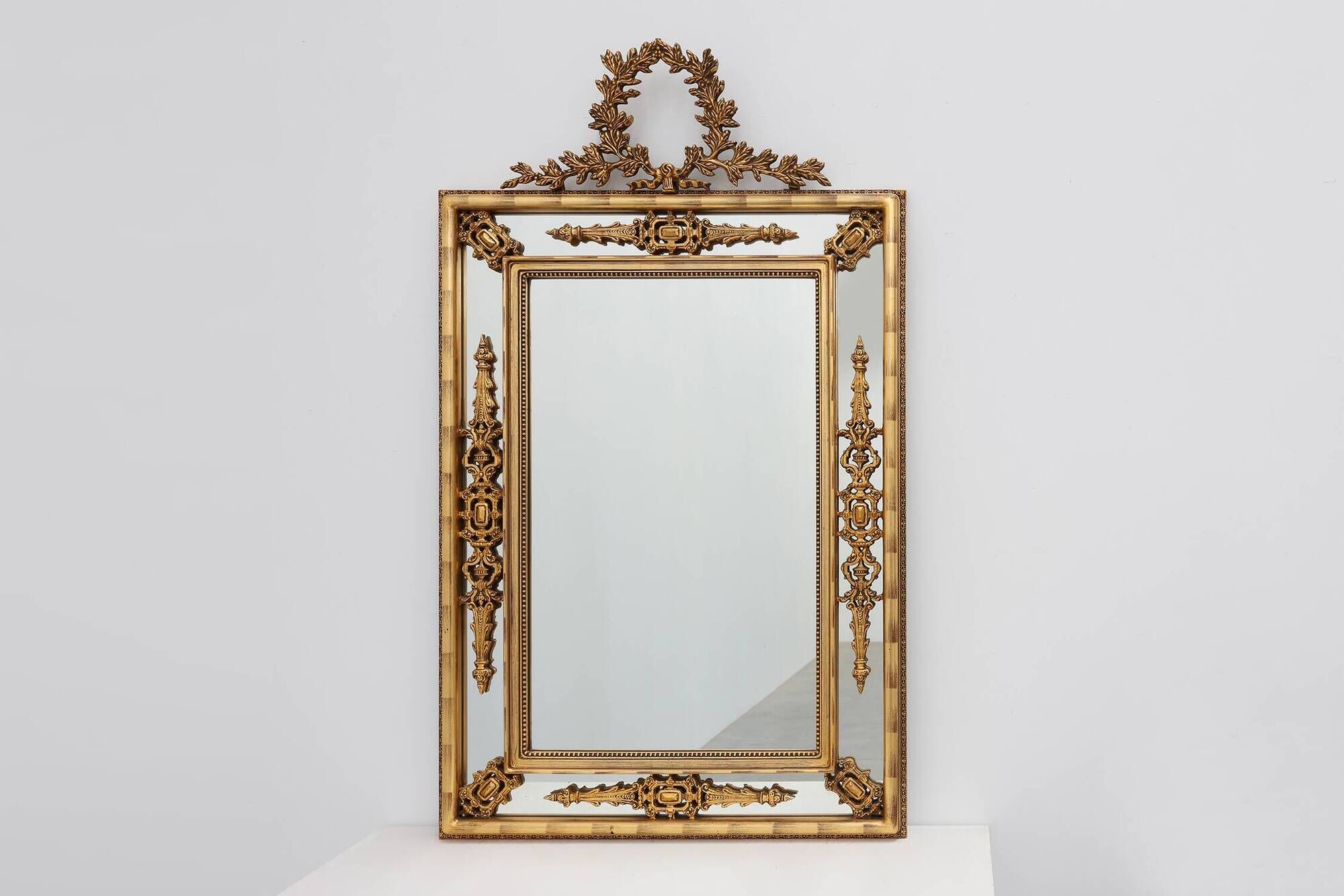 Louis XVI style gilt mirror with laurel wreath crest, Belgium, 20th century