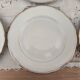Set of 6 flat plates in fine white Bohemian porcelain with a gold rim.