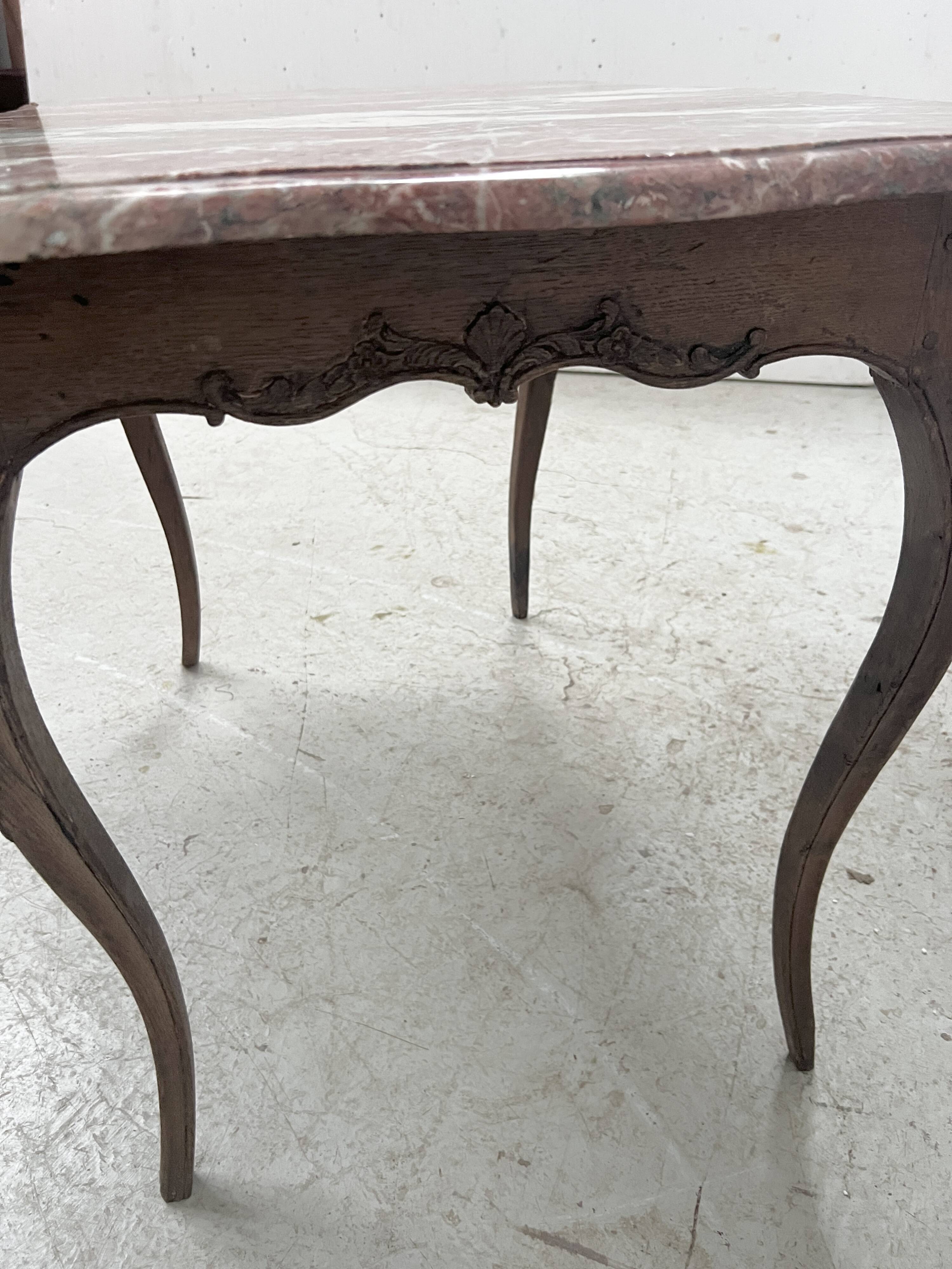 Louis XV mid-table in oak and marble, 18th century.