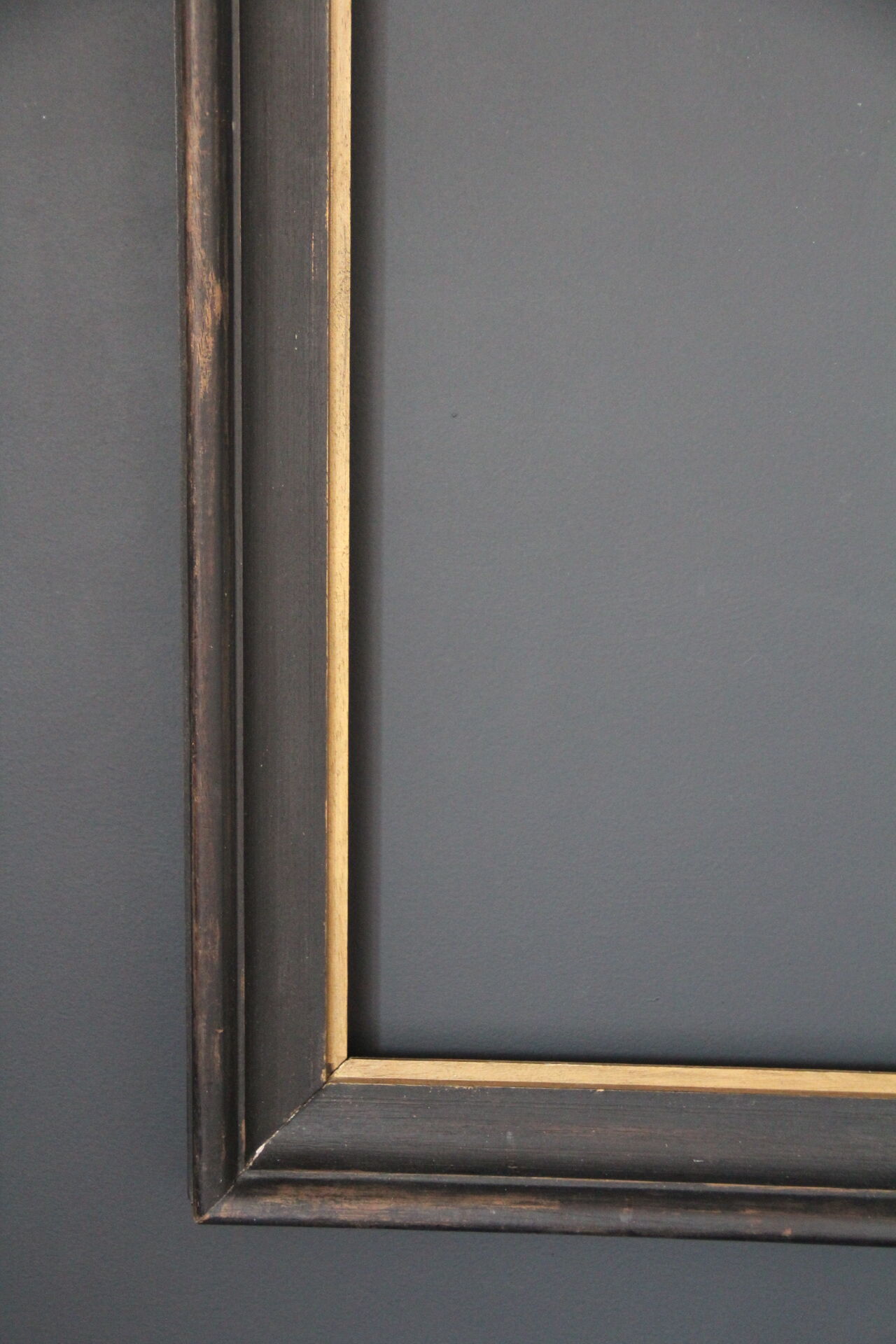 Large wooden black and gilded frame