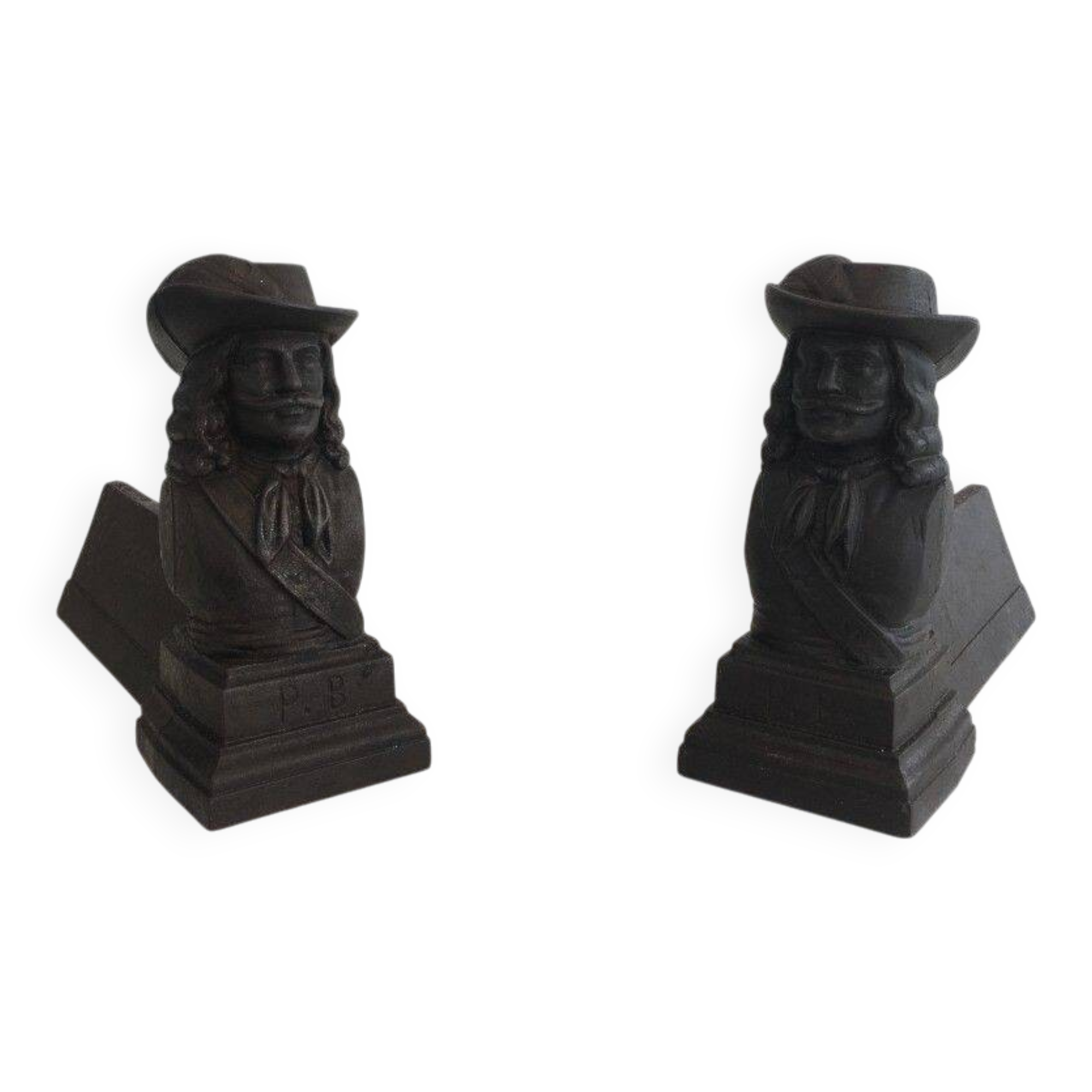 Pair of cast iron andirons in the likeness of a musketeer