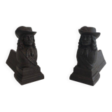 Pair of cast iron andirons in the likeness of a musketeer