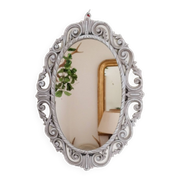 Louis XVI style patinated oval mirror