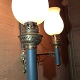 Brass wall sconce and frosted globe