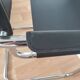 Pair of armchairs in chrome and black leather