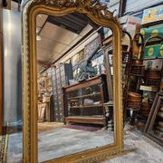 Large carved and gilded wooden mirror in Louis XV style
