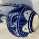 Glazed ceramic carafe with floral decoration