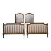 Pair of late 19th-century gilded wooden beds in Louis XVI style.