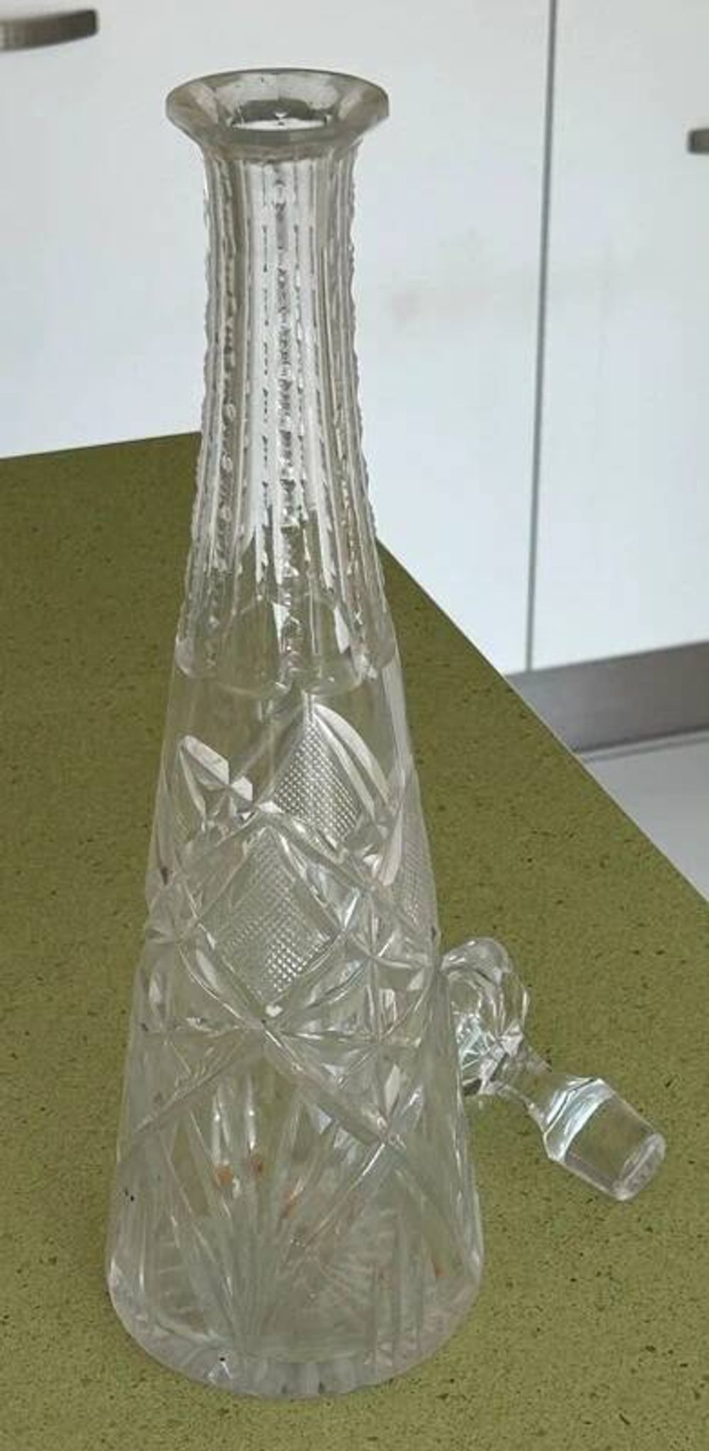 Long carafe with a cut Bohemian crystal stopper, design decor, 38.5 cm.