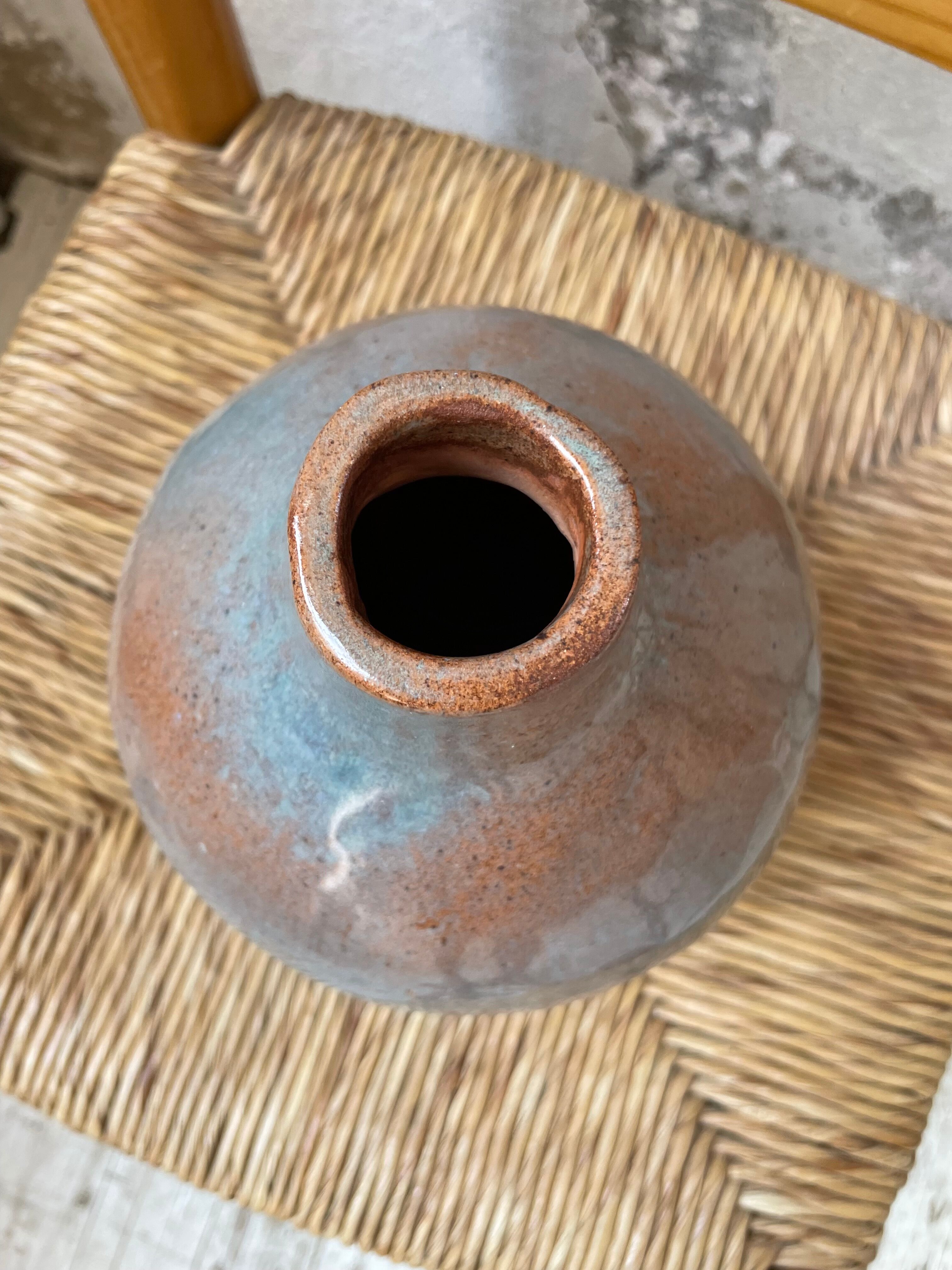 Glazed earth vase signed