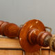 Carved wooden lamp, fiber shade