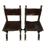 Pair of medieval style chairs in solid wood and leather, 19th century, circa 1850