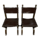 Pair of medieval style chairs in solid wood and leather, 19th century, circa 1850