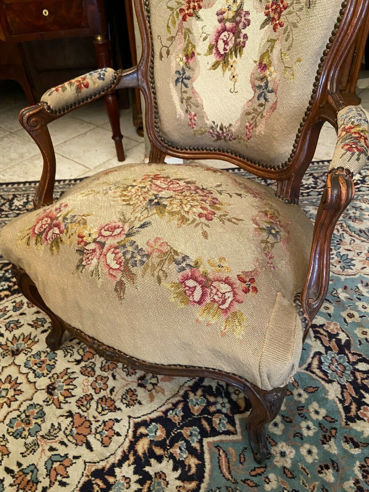 Armchair cabriolet eighteenth period Louis XV tapestry to the point floral decoration