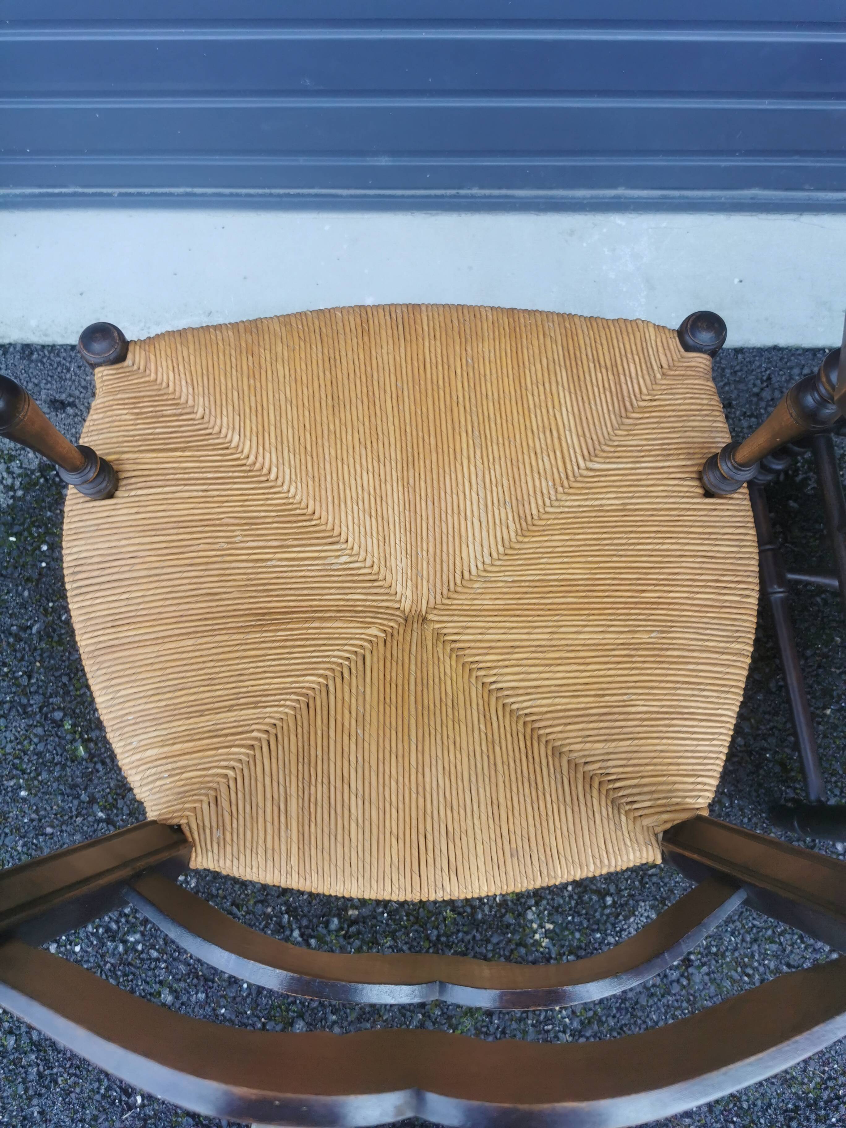 Pair of blackened wooden armchairs