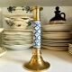 Candlestick in gilded brass and blue earthenware