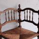 Antique corner chair "fireplace corner" in turned wood and straw.