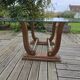 Art Deco coffee table in glass, wood, and brass.