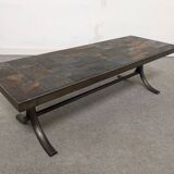 Brutalist coffee table in natural stone and wrought iron, France circa 1960.