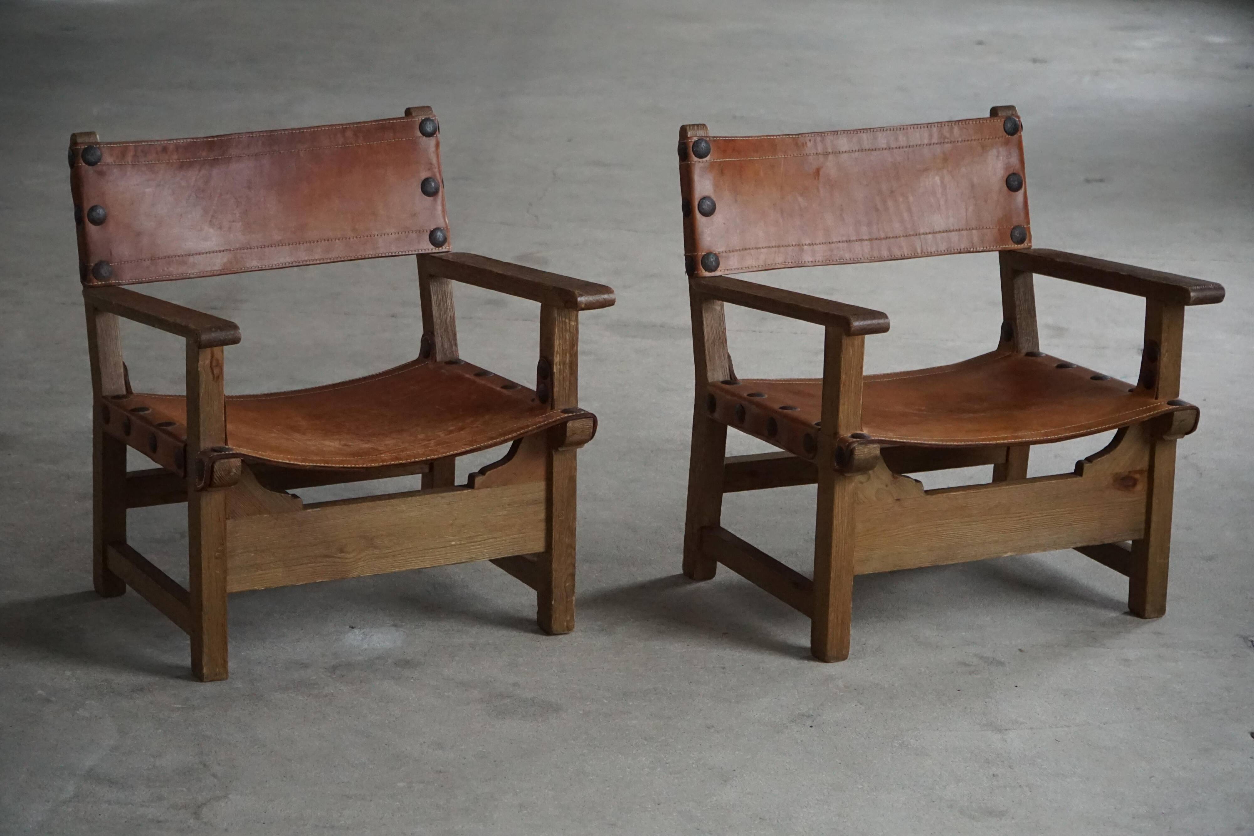 Pair of Spanish brutalist armchairs from the 1960s, wood and leather.
