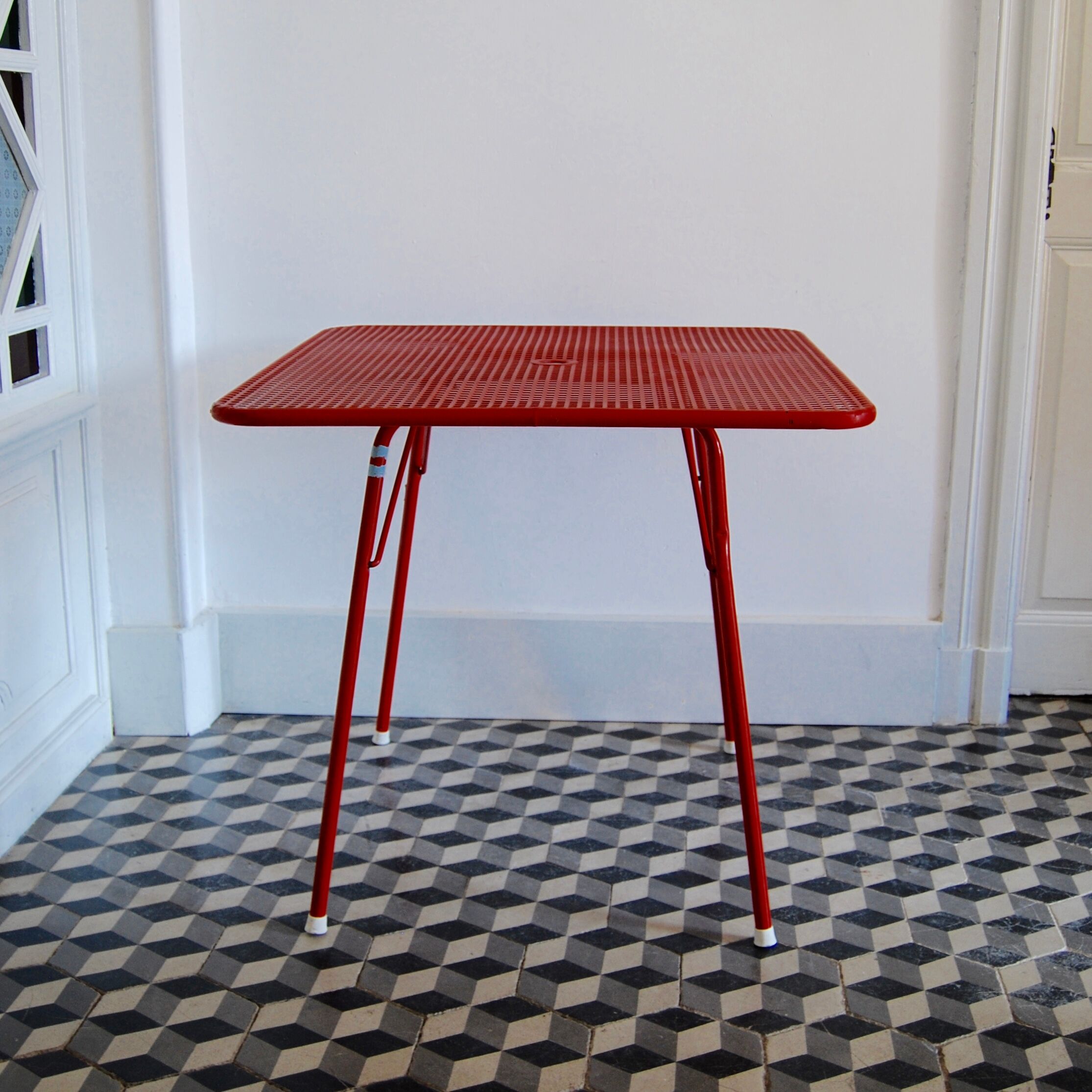 Red metal folding table Malaval type
