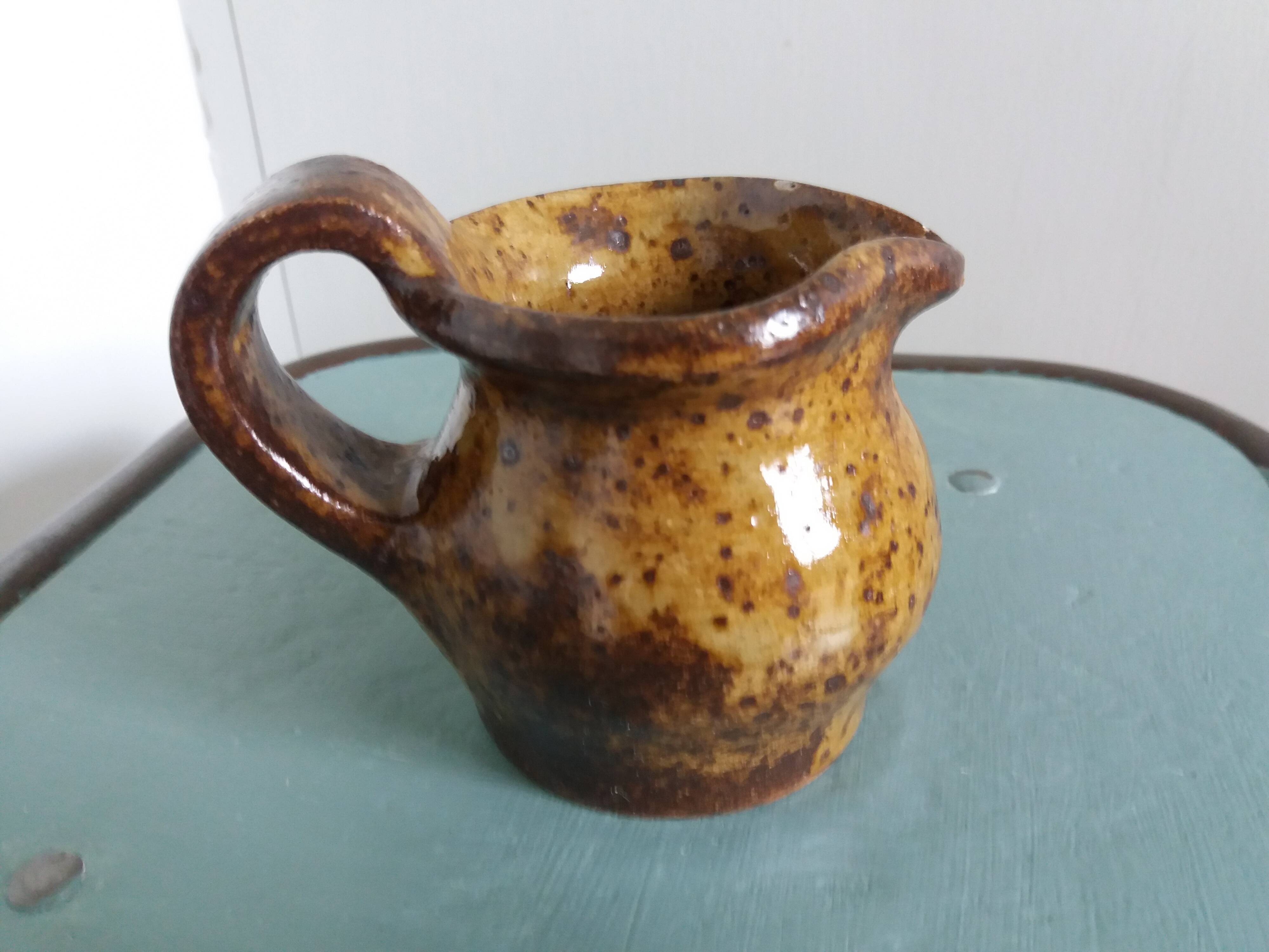 Stoneware pitcher signed cg