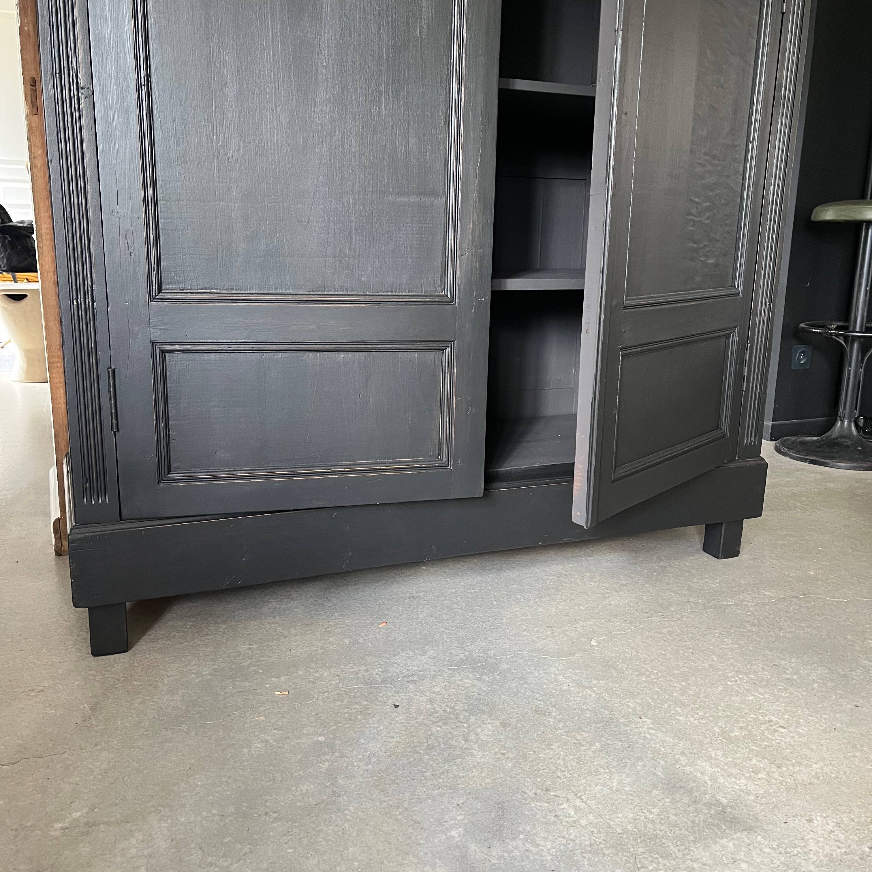 Large black wooden wardrobe