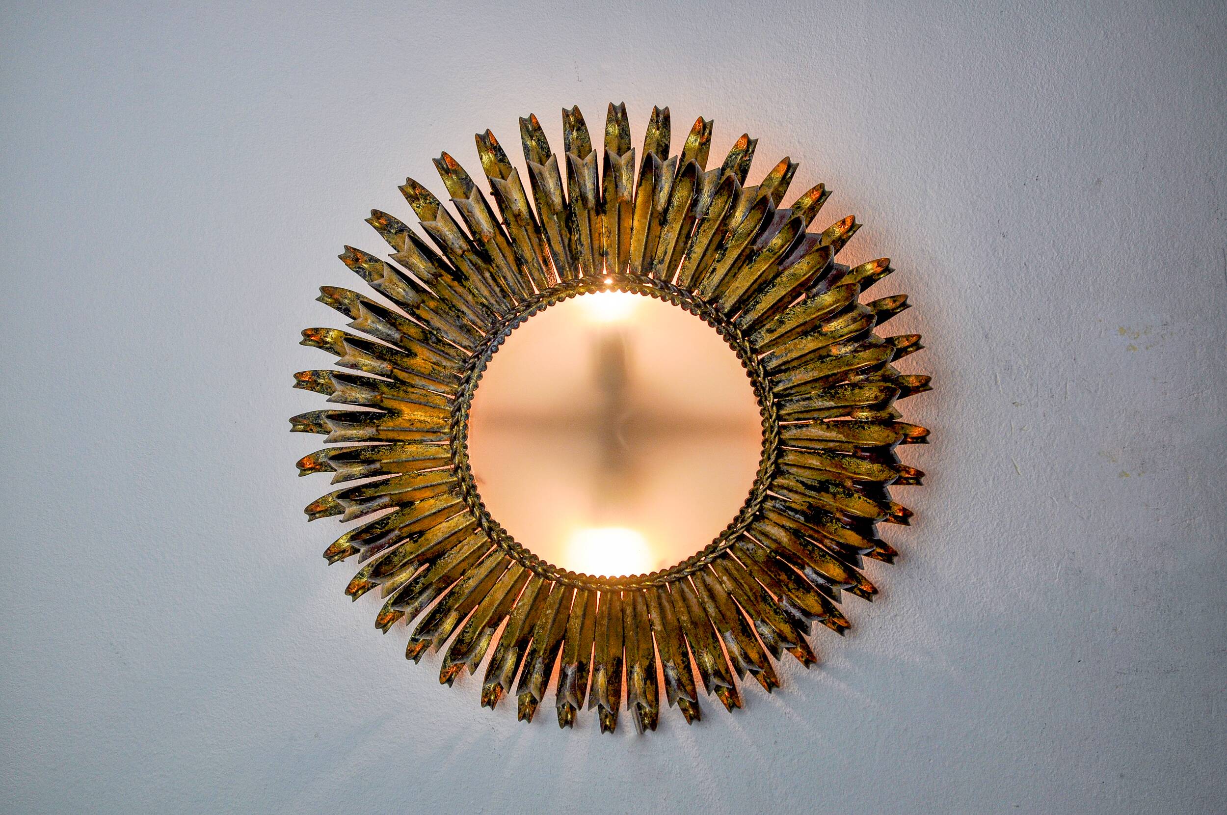 Sun wall lamp by ferro arte, metal and gold leaf, Spain, 1960