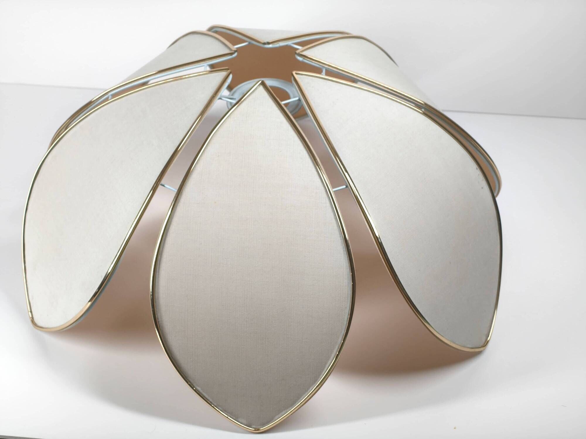 1970s ceiling light with floral design, light beige shade with gold finish.